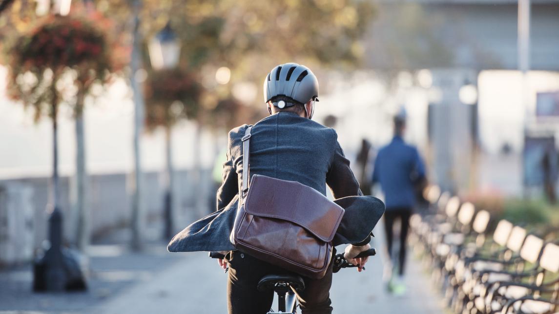 Business person commuting on a bicycle 