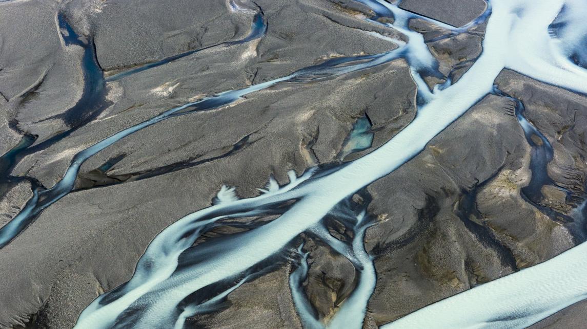 Rivers flowing from a melting glacier in Mt. Cook National Park