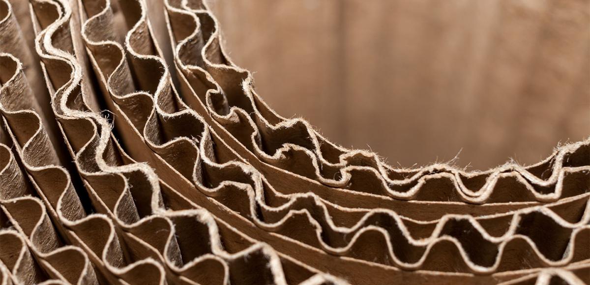 Close-up part of circular coil of corrugated cardboard