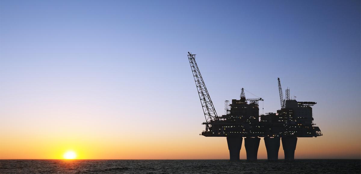 Oil and gas plant, sunset offshore platform