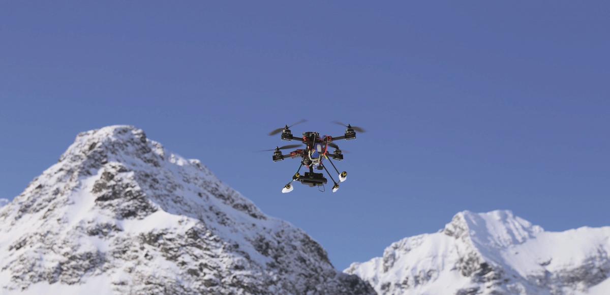 drone flying over mountain tops in the arctic