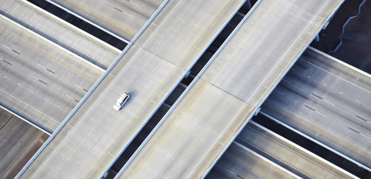 Aerial shot of one car on freeway