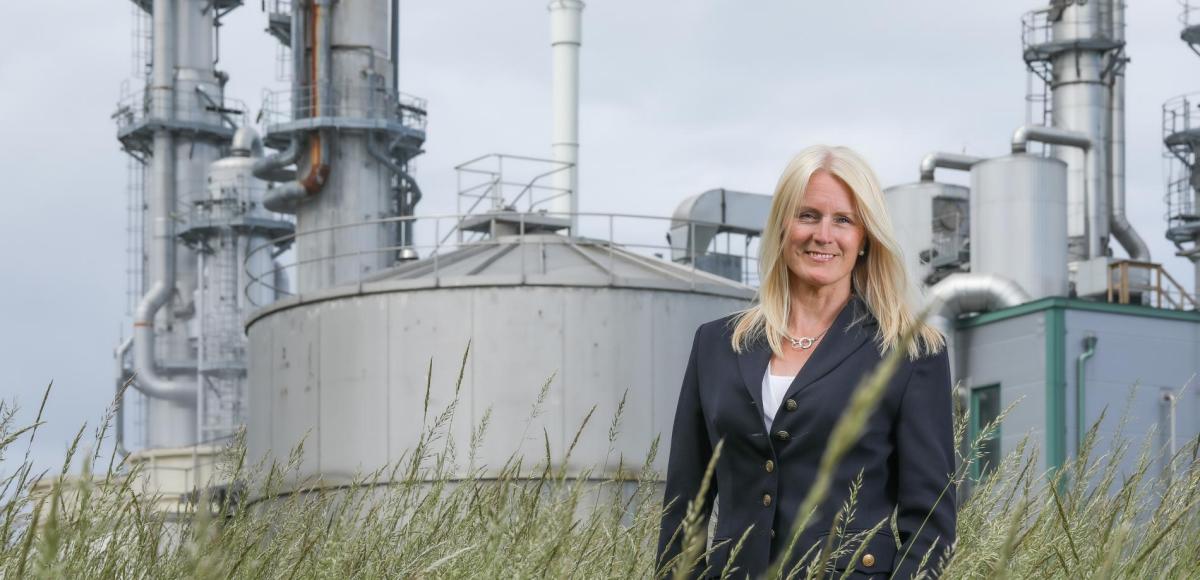 Woman standing in front of a industrial site in Sweden