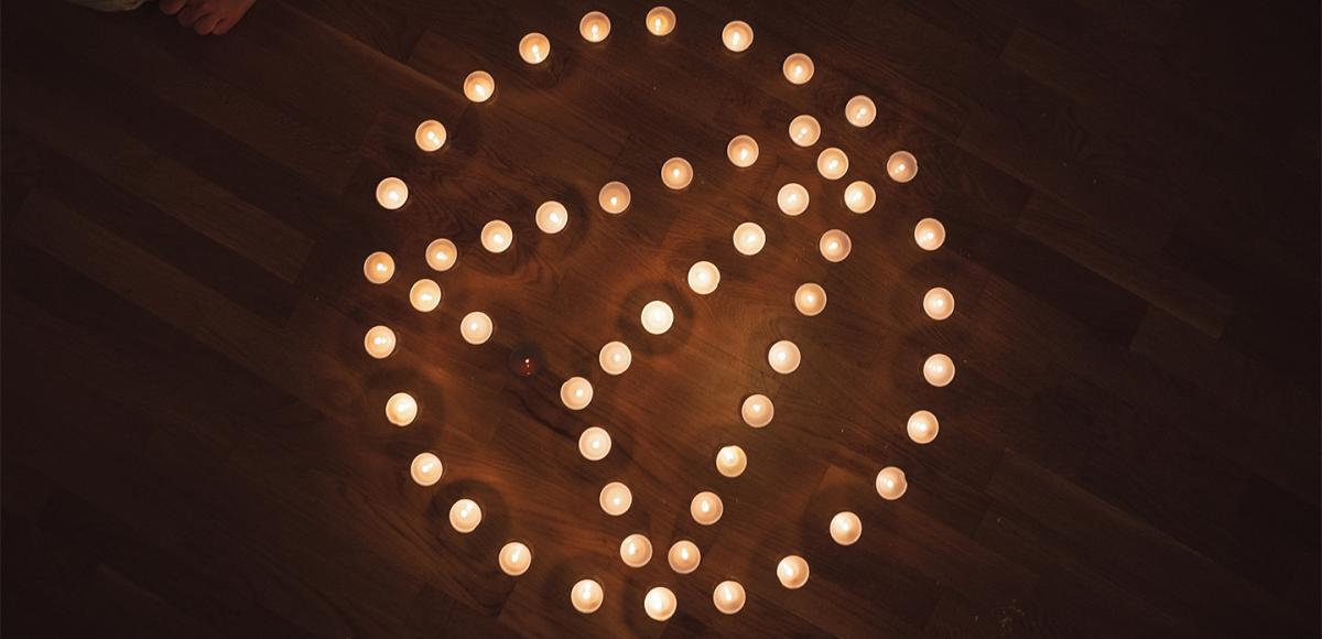 AFRY logo with candles