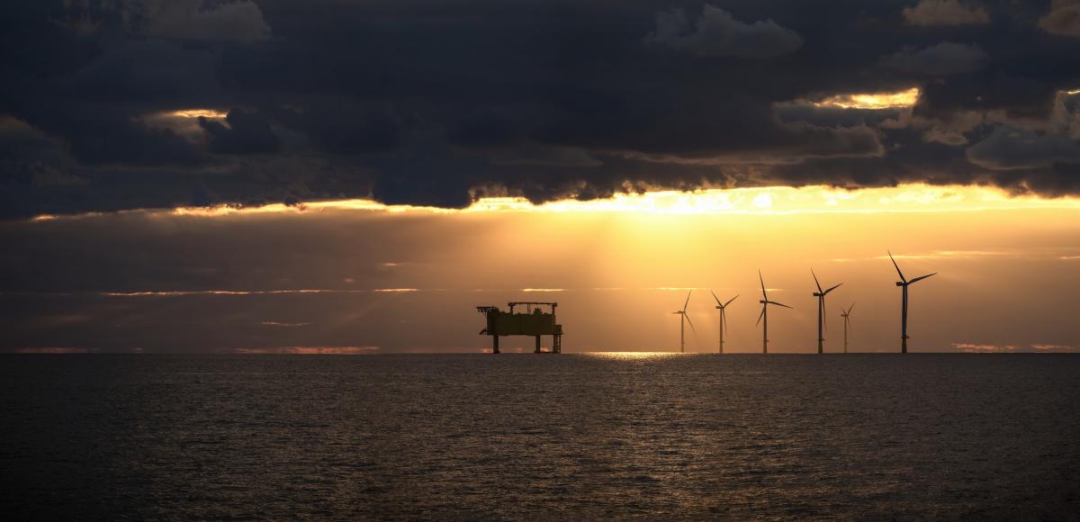 Wind farm on the north sea with sunset
