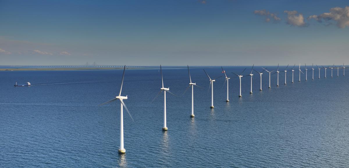 Offshore wind turbines in the blue sea