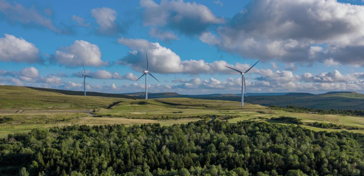 Aerial view of a small windfarm on a rural hillside in the South Wales Valleys, UK
