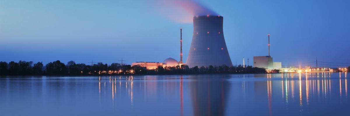 Nuclear power plant on shoreline at dusk