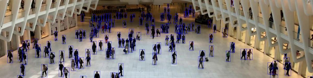 People in a large hall, detected by video