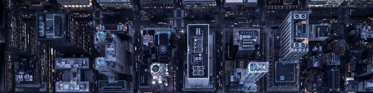 Aerial image of illuminated buildings in Manhattan, New York, between night and day