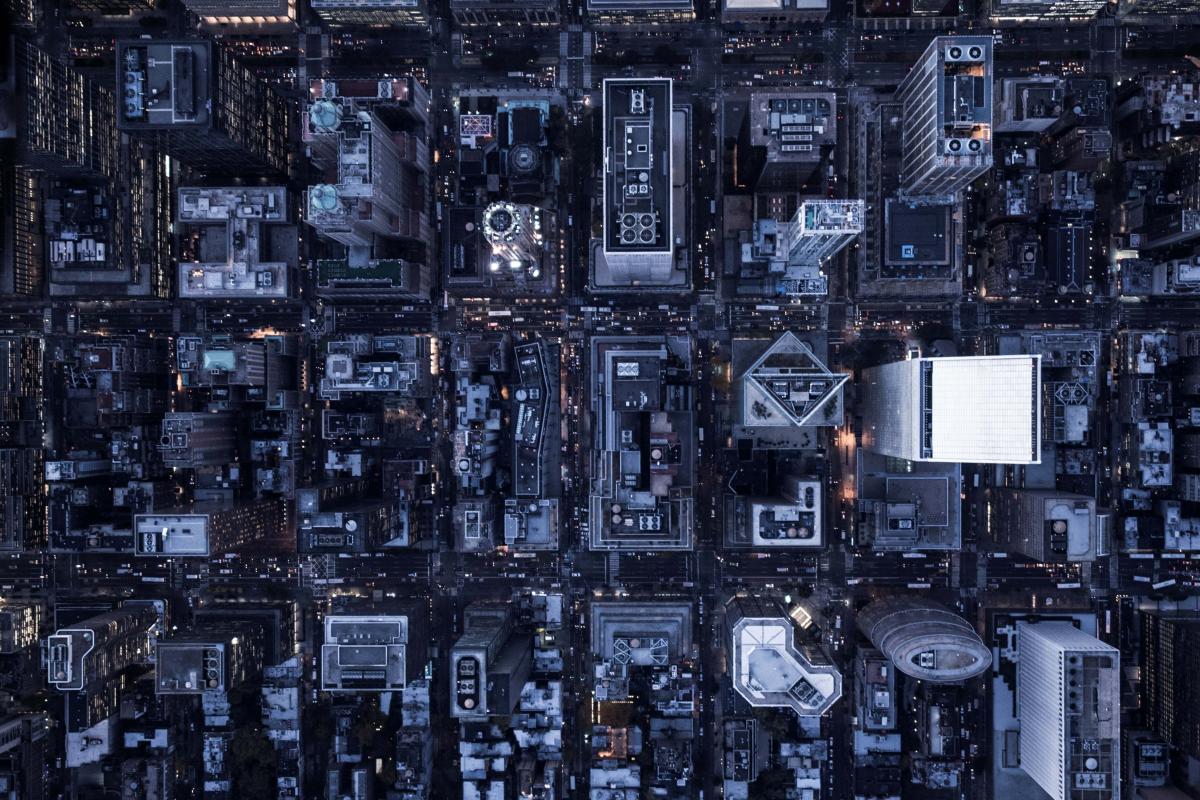 Aerial image of illuminated buildings in Manhattan, New York, between night and day