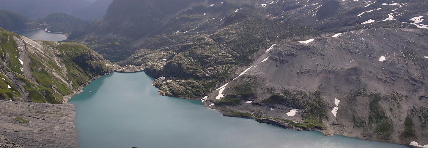 Aerial view of the Vieux Emosson Dam and reservoir looking toward the Emosson reservoir.