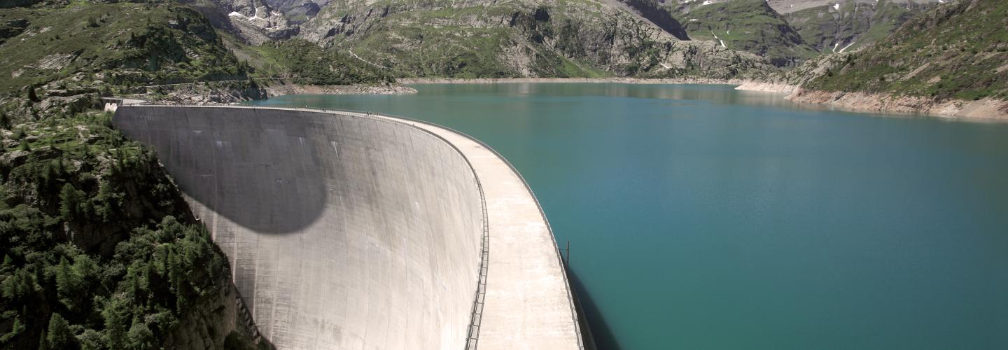Full reservoir behind the curved Emosson concrete arch dam