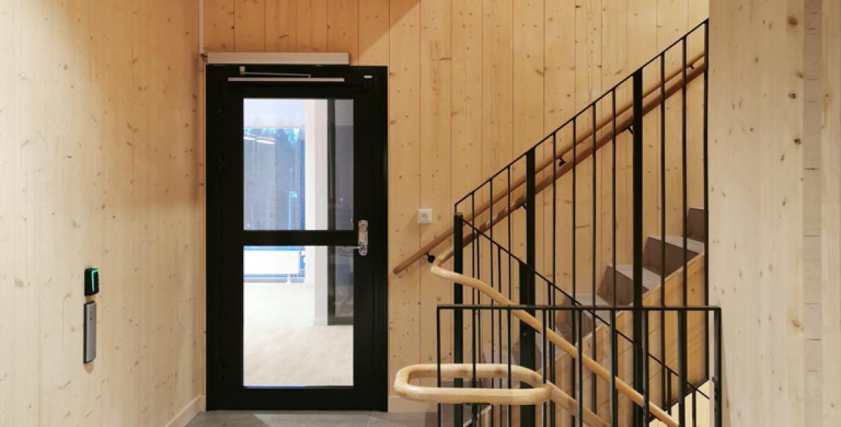 Hallway with a door in at the end in the komatsu forest building 