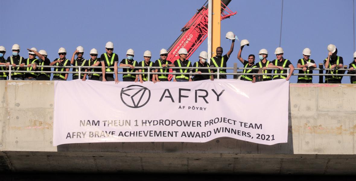 Nam Theun 1 Team at power intake with AFRY banner