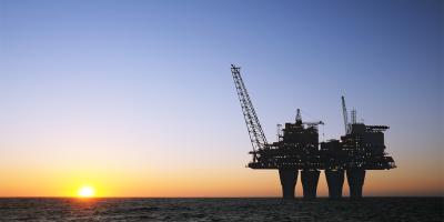 Oil and gas plant, sunset offshore platform