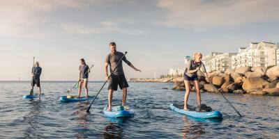 A group of people who ride SUP outside Malmö