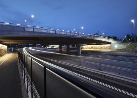 Motorway ramp and a bridge in the evening