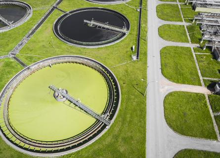 Sewage farm. Static aerial photo looking down onto the clarifying tanks and green grass.