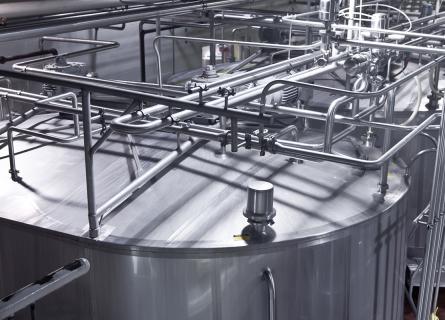 Stainless steel storage tanks at a dairy processing plant