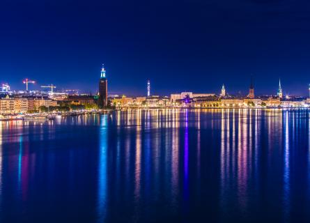 Stockholm city lights at night with reflections in water