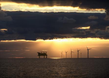 Wind farm on the north sea with sunset