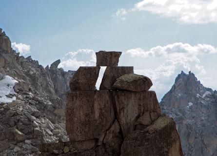 Rockpile in front of Swiss mountain peaks