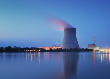Nuclear power plant on shoreline at dusk