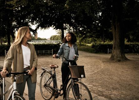 Young women spending time outside with bikes