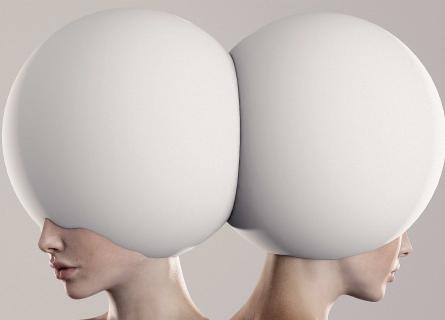 Two identical women with futuristic headpieces