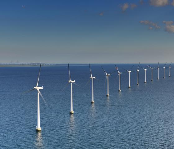 Offshore wind turbines in the blue sea