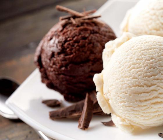 Ice cream balls chocolate vanilla on a plate food