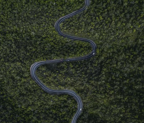 Aerial shot of winding forest road in Australia