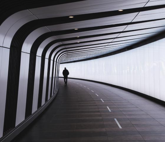 A man walking in a futuristic city