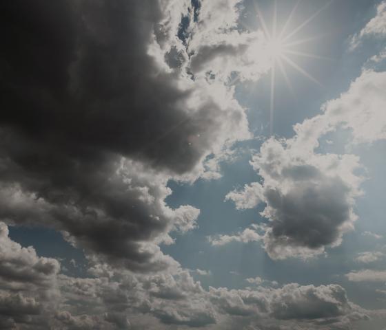 Clouds and sun in a blue sky