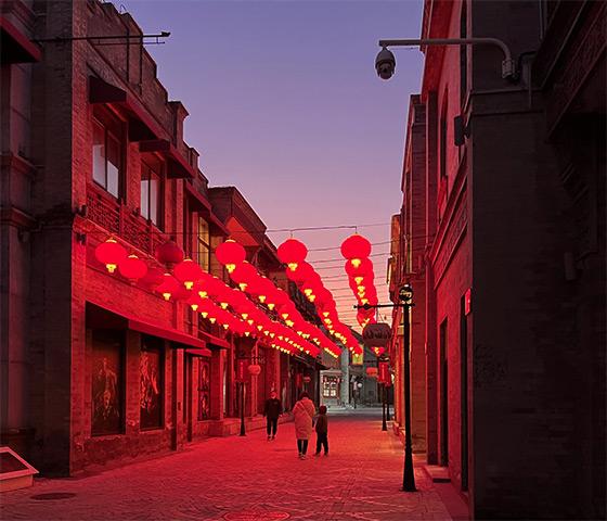 Beijing street illuminated by red lanterns