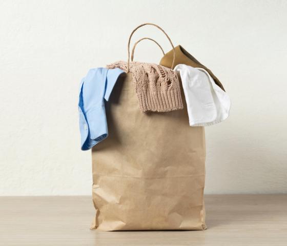 recycled clothes in a paper bag